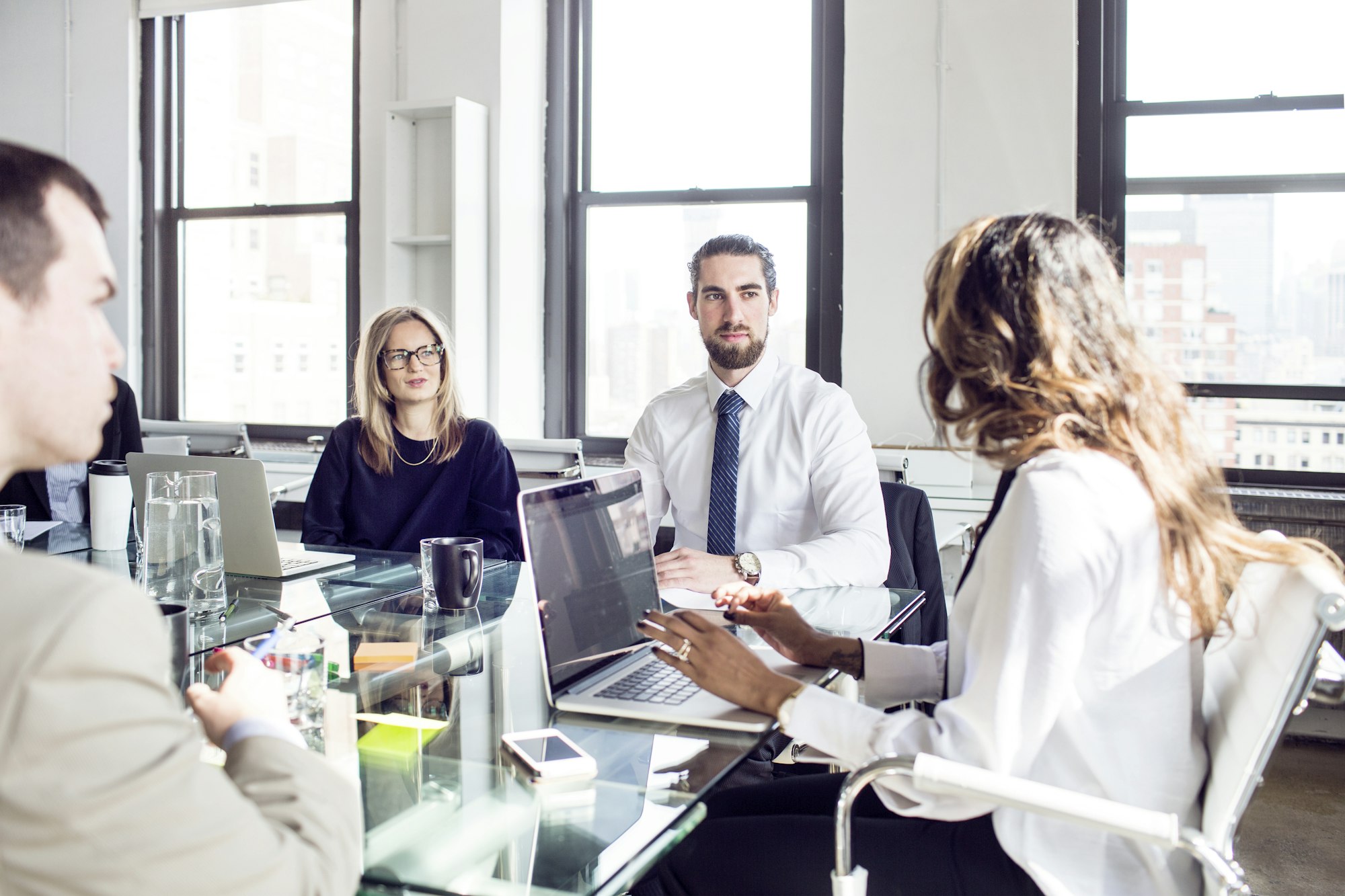 Business people discussing in board meeting at office