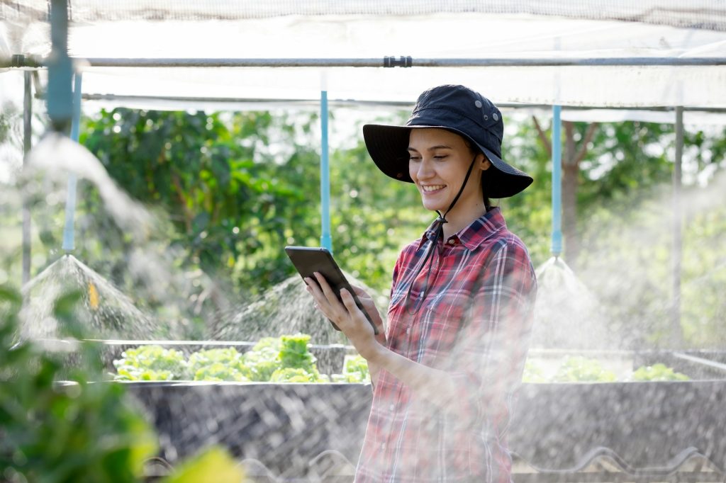 Farmer checking quality and water system control by tablet agriculture modern technology Concept.