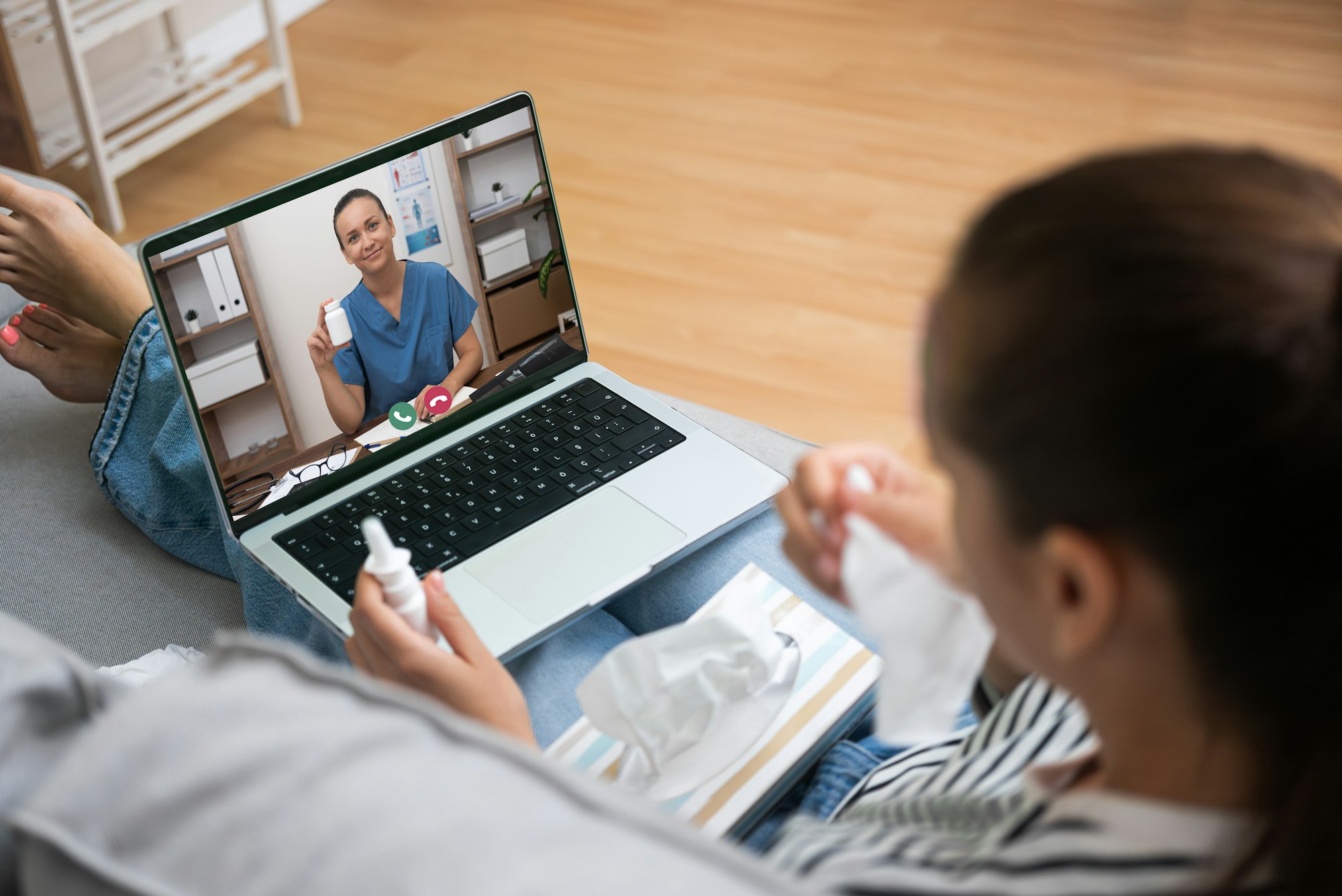 Patient holding medication while video conferencing with a healthcare provider